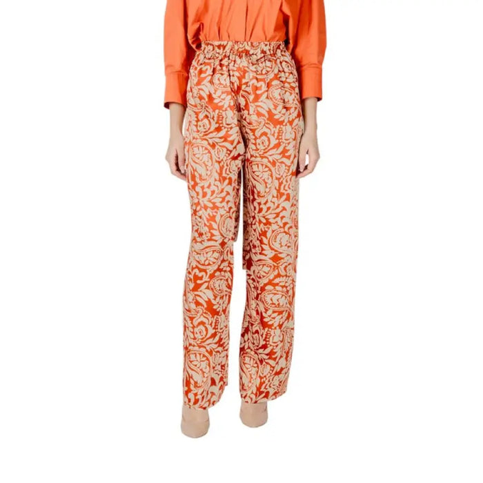 Floral patterned orange pants showcasing vibrant designs for a stylish look