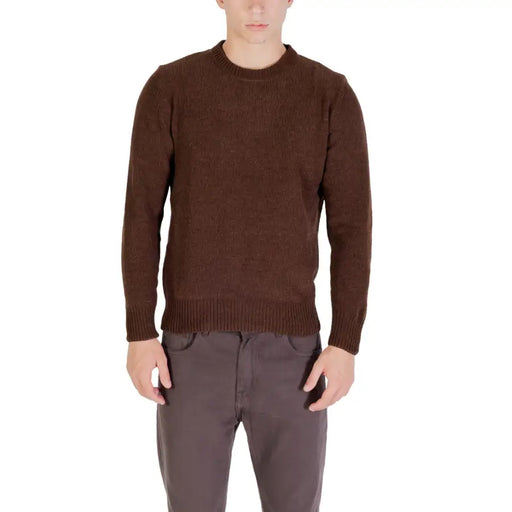 Brown textured sweater with ribbed cuffs and hem, likely made of wool or cotton blend.