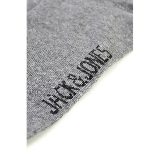 Gray cotton sock displaying brand name for comfortable everyday wear