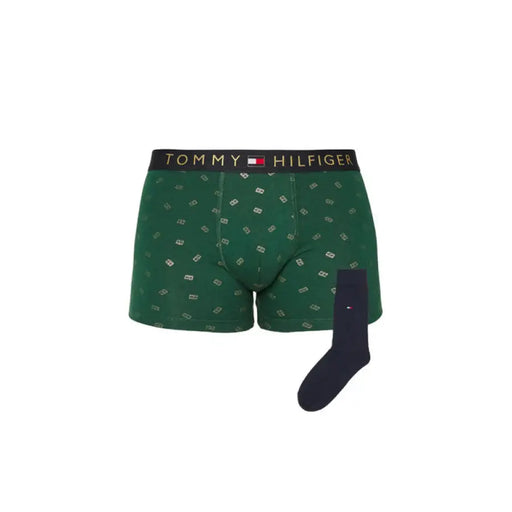Green Tommy Hilfiger boxer briefs paired with navy socks displayed in the product image