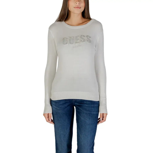 Light gray women’s long-sleeved sweater with sparkling GUESS logo and rhinestone embellishments