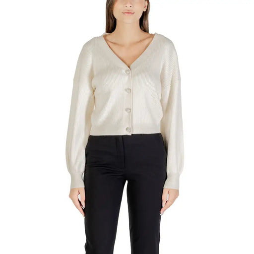 Women’s beige ribbed knit V-neck long cardigan with button closure for fall winter fashion