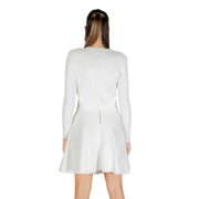 White ribbed long-sleeve top and flared mini skirt set displayed with Guess Women White Long Buttoned Round Neck Cardigan