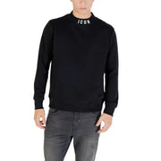 Men’s black long sleeve crewneck sweatshirt with ICON on the collar paired with grey jeans