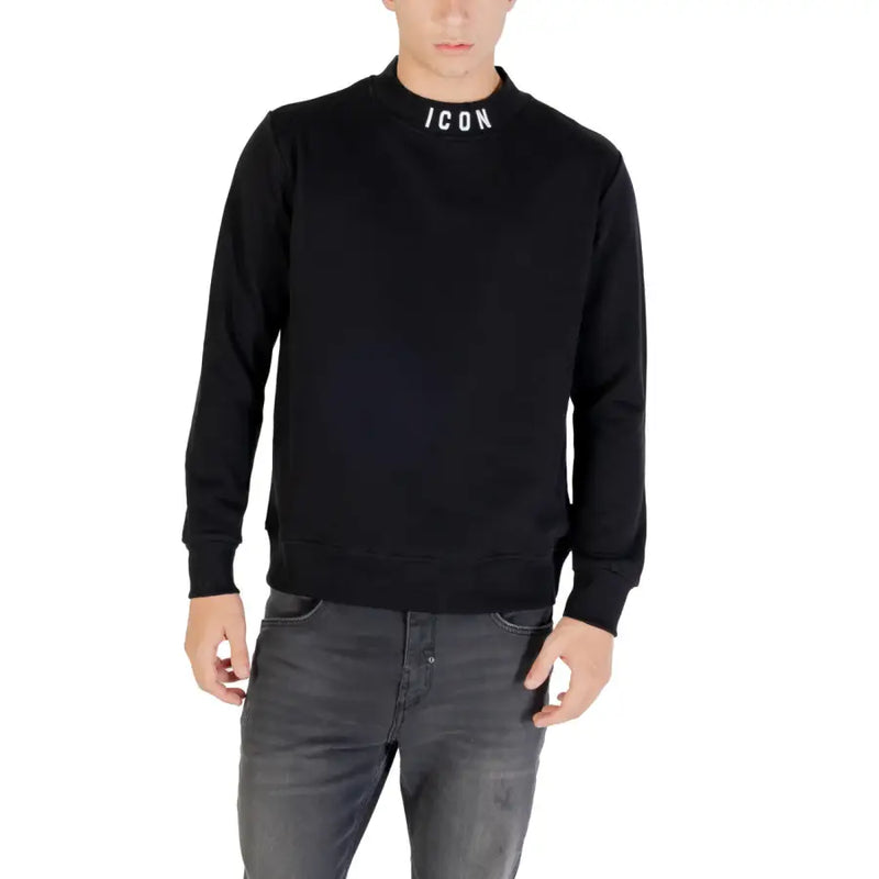 Men’s black long sleeve crewneck sweatshirt with ICON on the collar paired with grey jeans