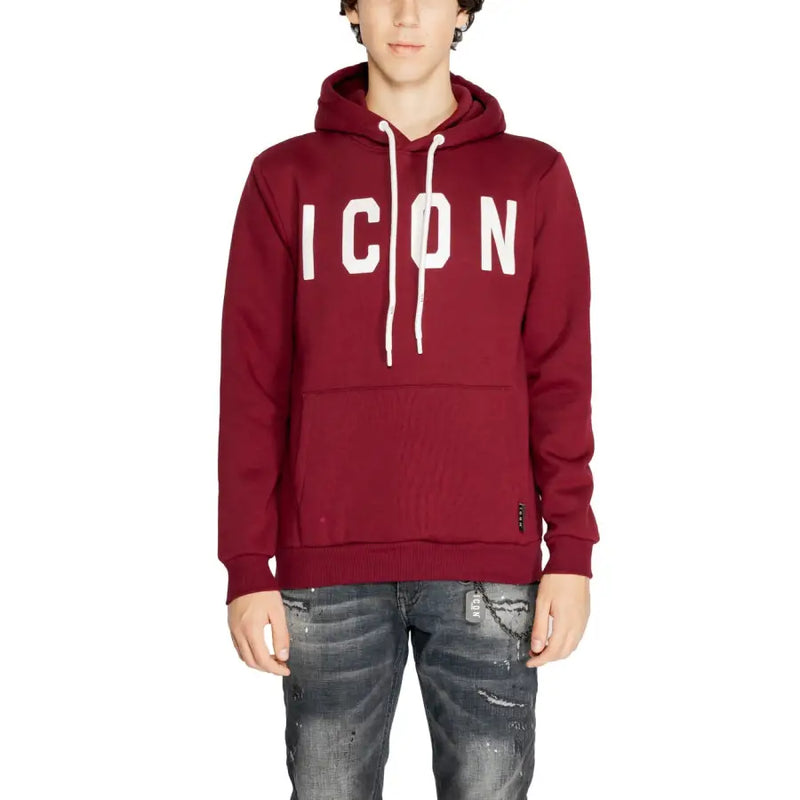 Men’s maroon hoodie with white ICON lettering, drawstrings, paired with distressed dark jeans
