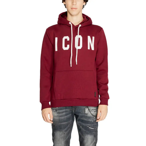 Men’s maroon hoodie with white ICON lettering, drawstrings, paired with distressed dark jeans