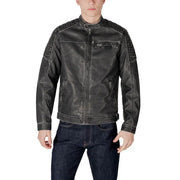 Men’s distressed black faux leather biker jacket with quilted shoulders and white stitching over dark wash jeans
