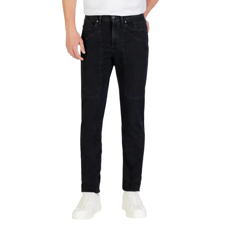Black slim fit jeans with white stitching and pockets, likely from a popular denim brand.