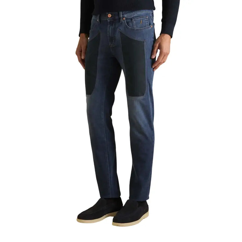 Dark blue jeans with black patches and gold buttons, levi’s 501 model.