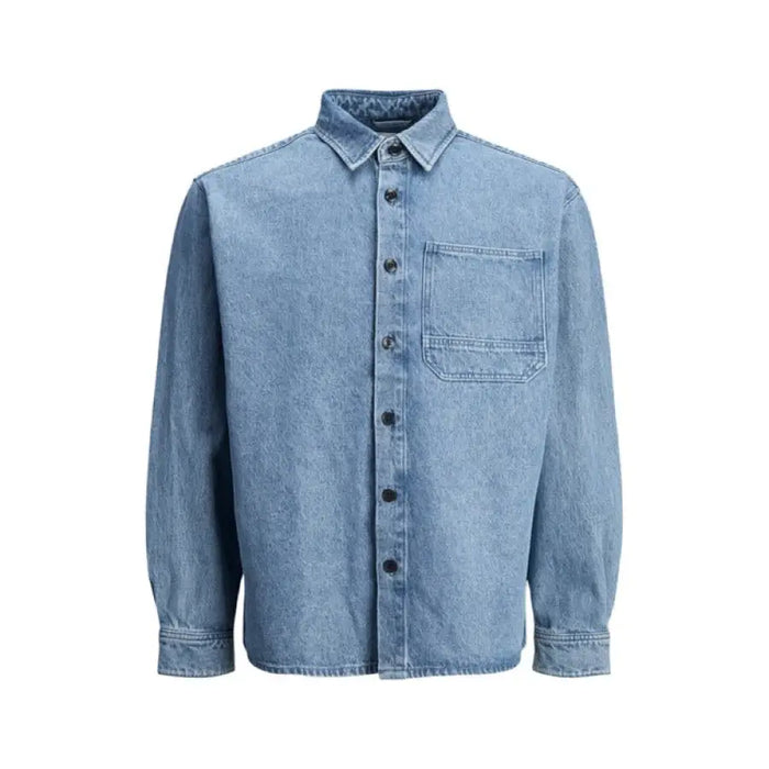 Light blue denim shirt displayed with casual denim jacket and dark jeans