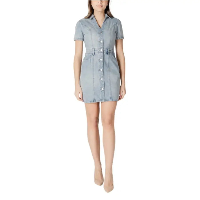 Light blue denim shirt dress displayed, stylish and casual for versatile wear
