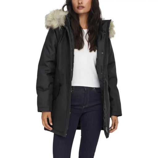Long black hooded jacket for women featuring a fur-lined hood, zipper, and automatic buttons