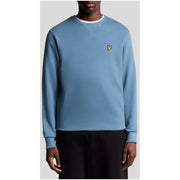 Men’s sky blue crewneck sweatshirt with yellow bird logo from Lyle & Scott