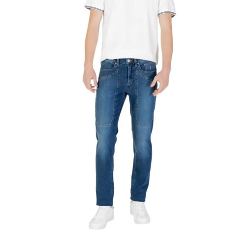 Male model wearing blue jeans and white sneakers for the Man in Blue Jeans and White Sneakers product