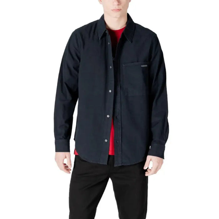 Man wearing a Mens Dark Button Down Shirt displaying a stylish dark button-down shirt for men