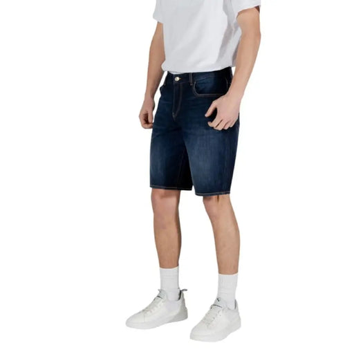 Man wearing Armani Exchange Men Blue Cotton Shorts in denim style