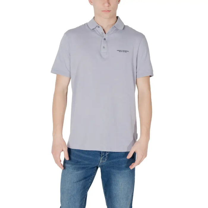 Man wearing Armani Exchange men’s blue polo shirt and blue jeans