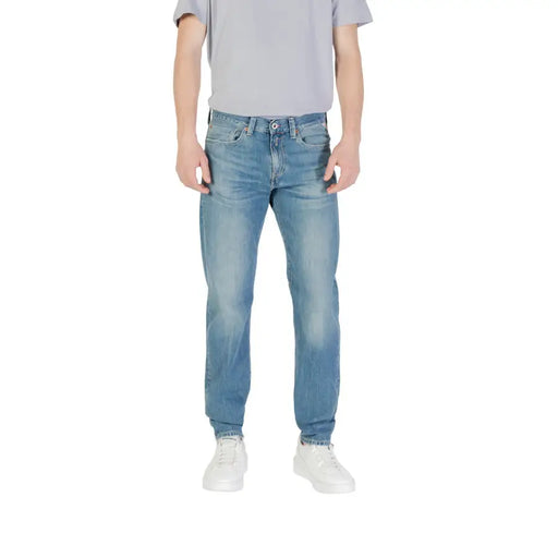 Man wearing Light Blue Denim Jeans and Gray T-Shirt displayed in Men’s Light Blue Denim Jeans product image