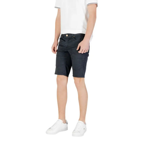 Man wearing navy shorts from Mens Casual Shorts T Shirt And Sneaker Collection