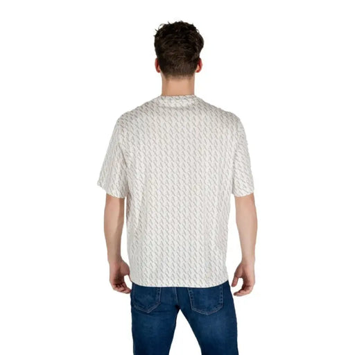 Man in patterned short-sleeved T-shirt and jeans displaying the Patterned Short Sleeve T Shirt product