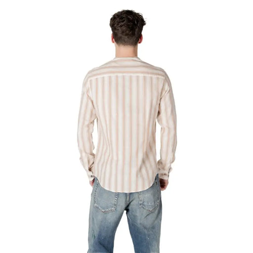 Man in a striped button shirt and jeans showcasing Gianni Lupo Men’s Beige Striped Shirt