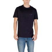 Men’s navy blue crew-neck short-sleeve T-shirt paired with light blue jeans