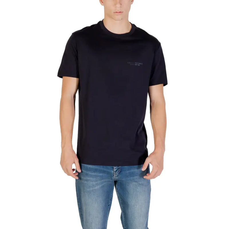Men’s navy blue crew-neck short-sleeve T-shirt paired with light blue jeans