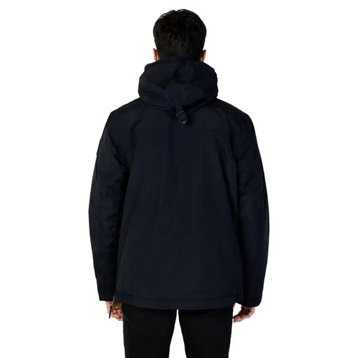 Black puffer jacket with hood and zipper closure.