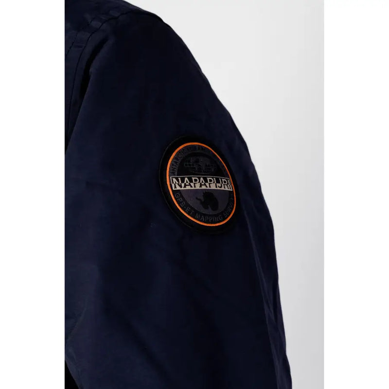 Navy blue jacket with orange and white logo patch, made of nylon material.