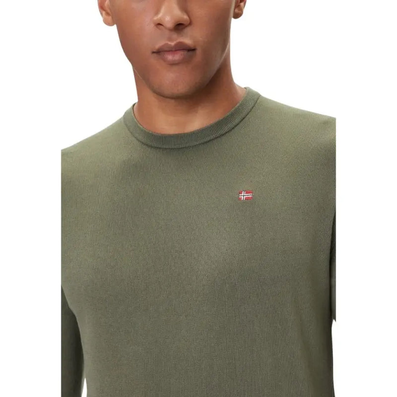 Olive green crew neck sweater with small flag patch on left chest.