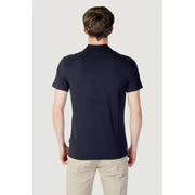 Navy blue polo shirt with white logo and ribbed collar, made of cotton.
