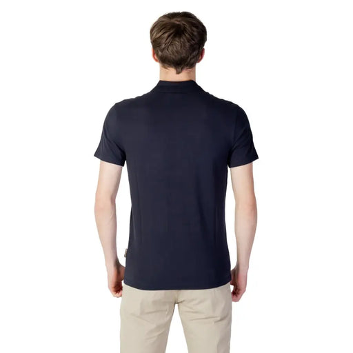 Navy blue polo shirt with short sleeves and a collar, featuring small embroidered logo on the left chest.