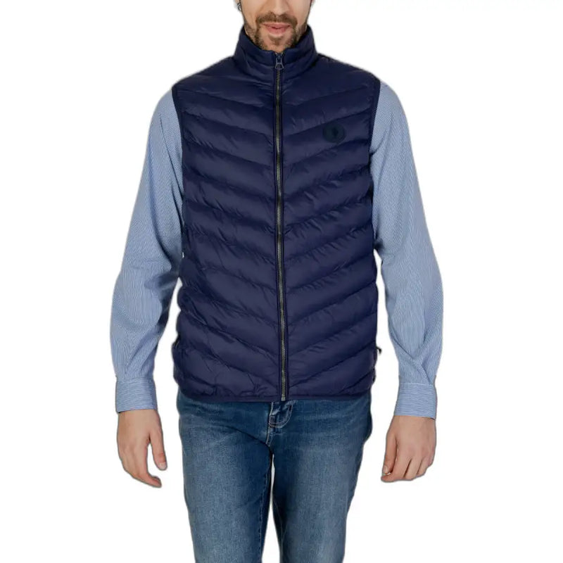 Navy blue quilted puffer vest displayed in a product image on a retail website