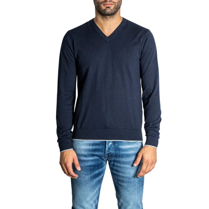 Navy blue V-neck sweater featured in Blue Shirt and Jeans outfit display