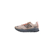 New balance trail running shoe, beige and coral accents, mesh upper with rubber sole.