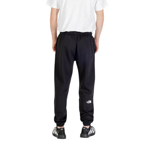 Men’s black sweatpants with logo on lower left leg from The North Face Fall Winter collection