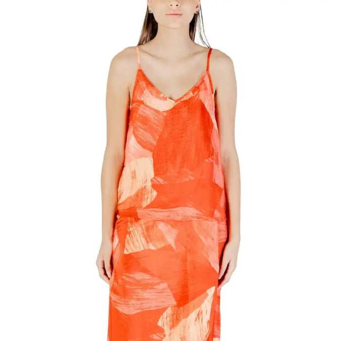 Orange abstract print slip dress showcased for fashionable and elegant occasion wear