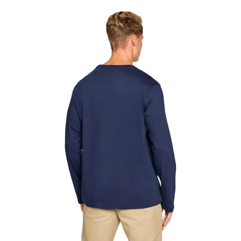 Men’s navy blue long-sleeved cotton shirt paired with khaki pants from Ralph Lauren