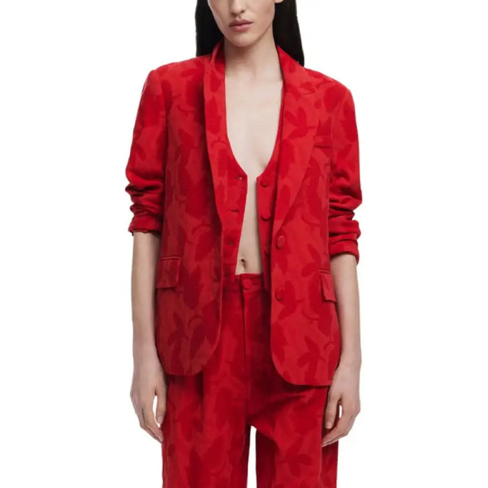 Red floral patterned blazer suit displayed on a mannequin for stylish formal wear