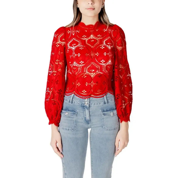 Red lace long-sleeved blouse displayed on a model, elegant and fashionable attire