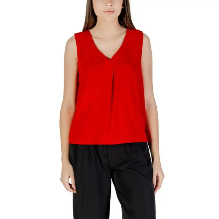 Red sleeveless V-neck blouse displayed on a mannequin for the Red Sleeveless V Neck Blouse product