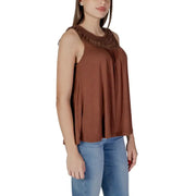 Brown viscose sleeveless tank top with textured neckline paired with light blue jeans