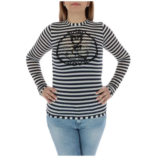 Women striped long sleeve shirt with anchor embellishment displayed in product image