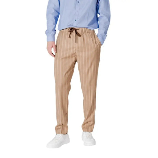 Beige striped trousers by Gianni Lupo featuring drawstring and pockets