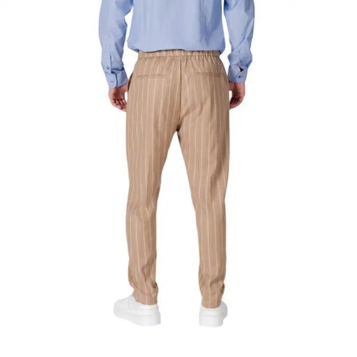 Tan striped trousers from Gianni Lupo featuring laces and pockets for men