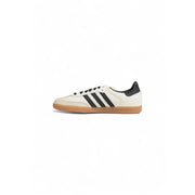 White Adidas Samba sneakers with black stripes and gum sole for women in fall winter collection