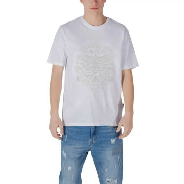 White graphic T shirt styled with Blue Jeans in a fashionable casual outfit