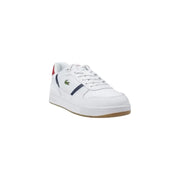 White Lacoste leather sneaker with red and blue accents displayed in a product image