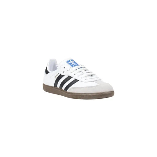White leather Adidas women’s lace-up sneakers with black stripes and gum sole